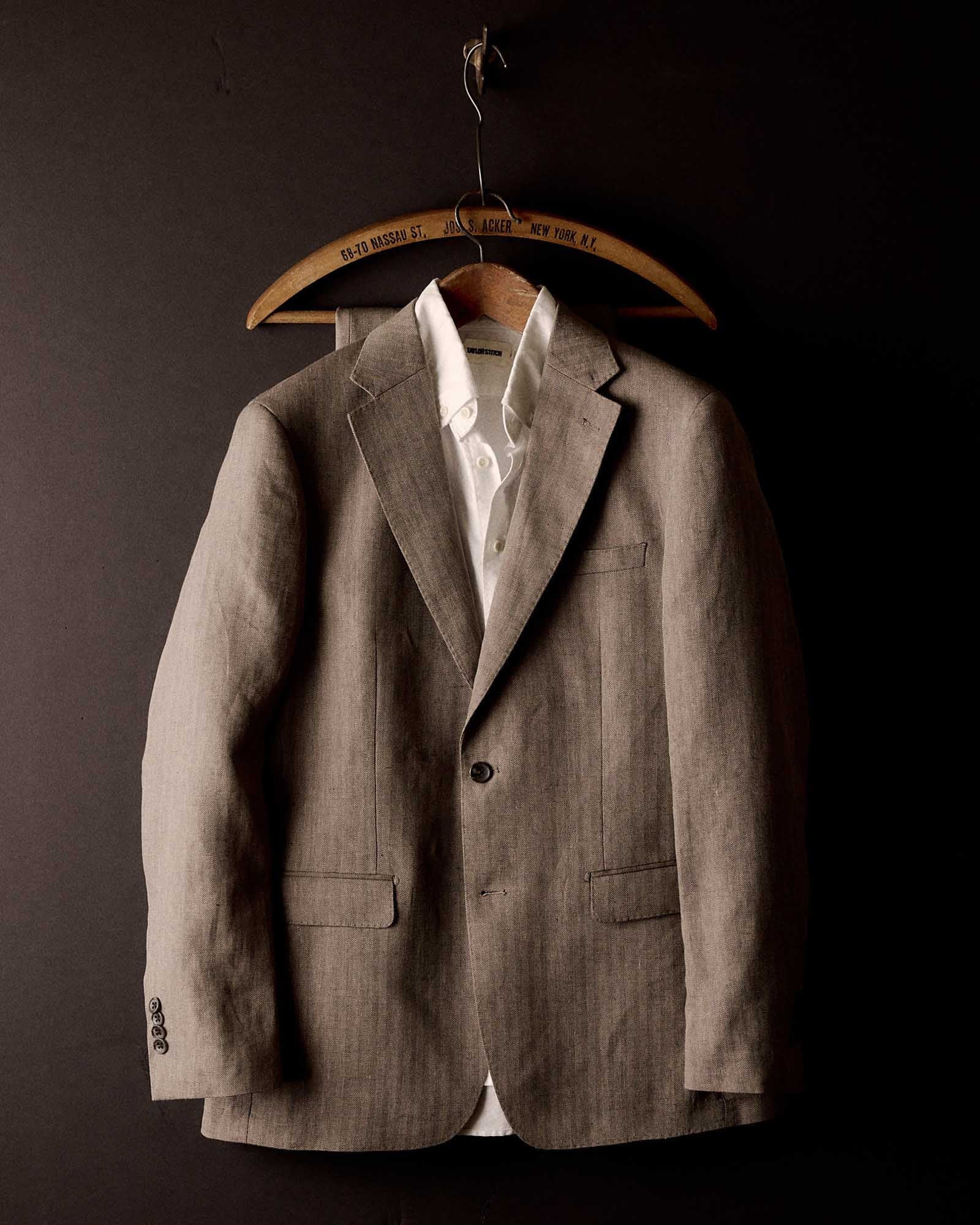 editorial image of The Stevens Sportcoat in Coffee Linen Herringbone hanging, Outerwear by Taylor Stitch