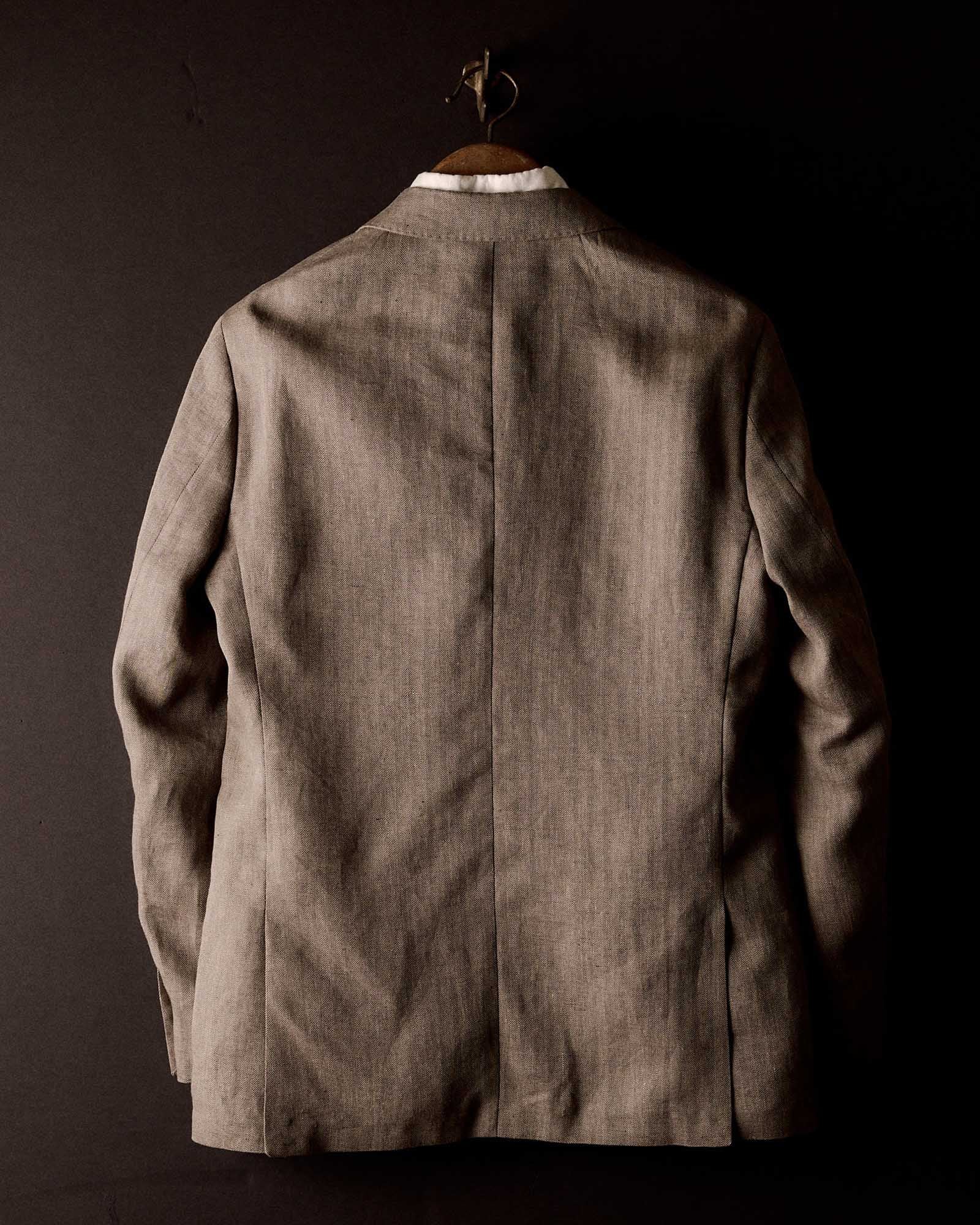 editorial image of the back of The Stevens Sportcoat in Coffee Linen Herringbone, Outerwear by Taylor Stitch