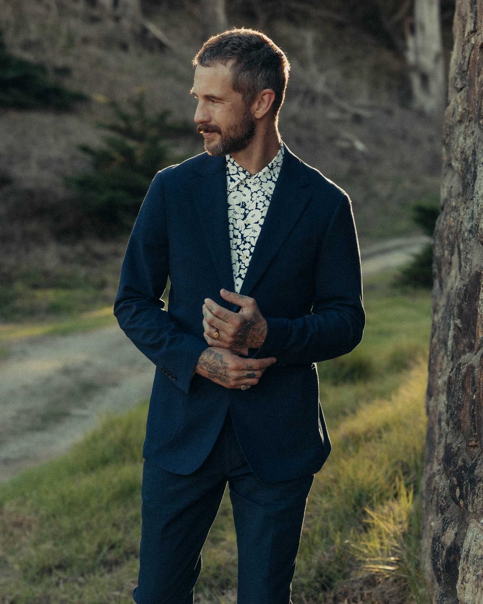 fit model adjusting the cuffs on The Stevens Sportcoat in Navy Linen Seersucker, Outerwear by Taylor Stitch