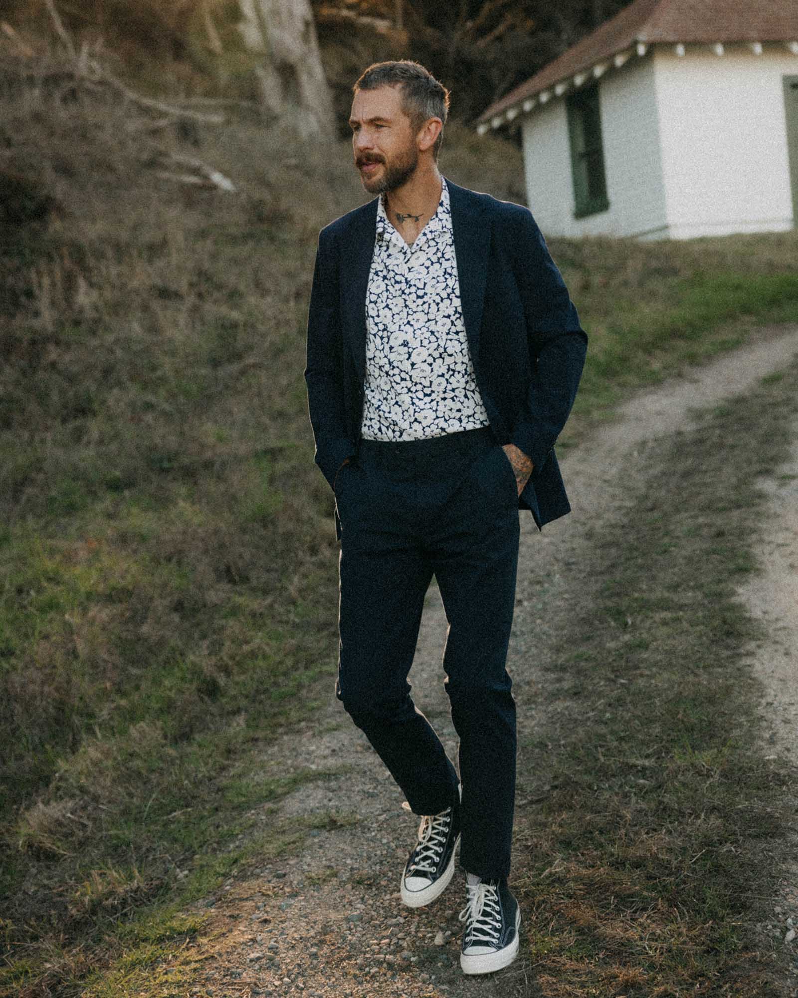 fit model walking wearing The Stevens Sportcoat in Navy Linen Seersucker, Outerwear by Taylor Stitch
