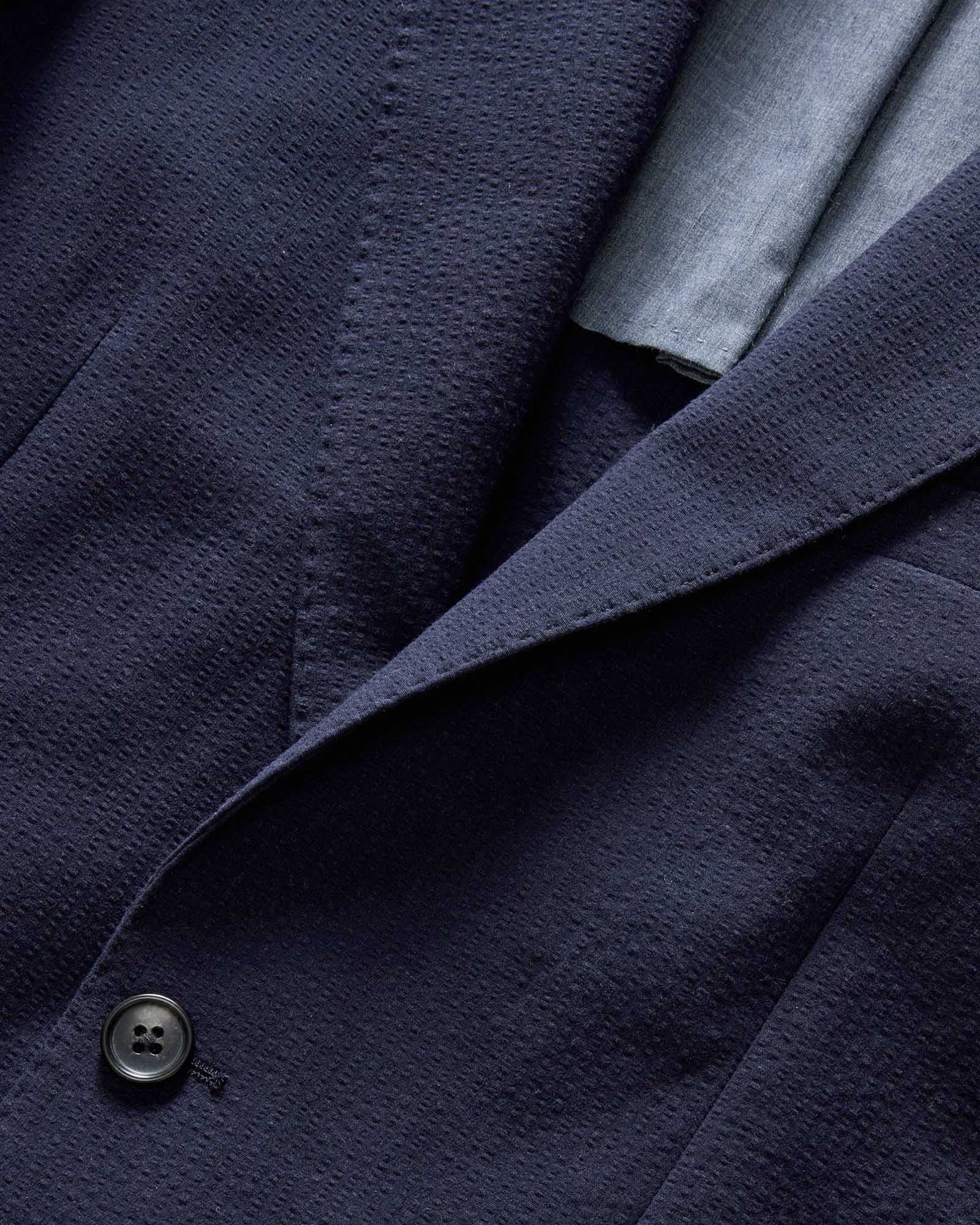 material shot of the collar on The Stevens Sportcoat in Navy Linen Seersucker, Outerwear by Taylor Stitch