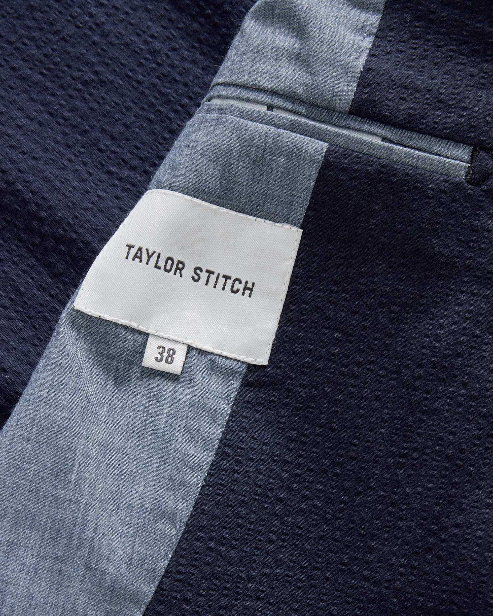 material shot of the tag on The Stevens Sportcoat in Navy Linen Seersucker, Outerwear by Taylor Stitch