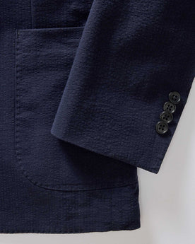 material shot of the cuff and buttons on The Stevens Sportcoat in Navy Linen Seersucker, Outerwear by Taylor Stitch