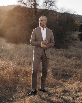 fit model posing in The Stevens Trouser in Coffee Linen Herringbone, Bottoms by Taylor Stitch