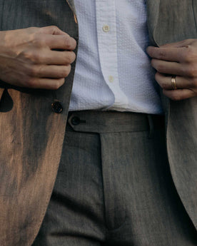 fit model posing in The Stevens Trouser in Coffee Linen Herringbone, Bottoms by Taylor Stitch