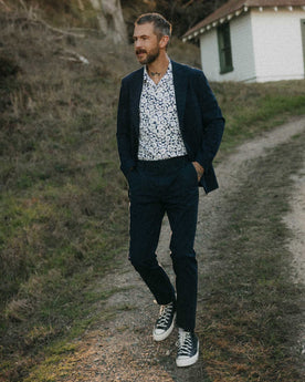 fit model walking wearing The Stevens Trouser in Navy Linen Seersucker, Bottoms by Taylor Stitch