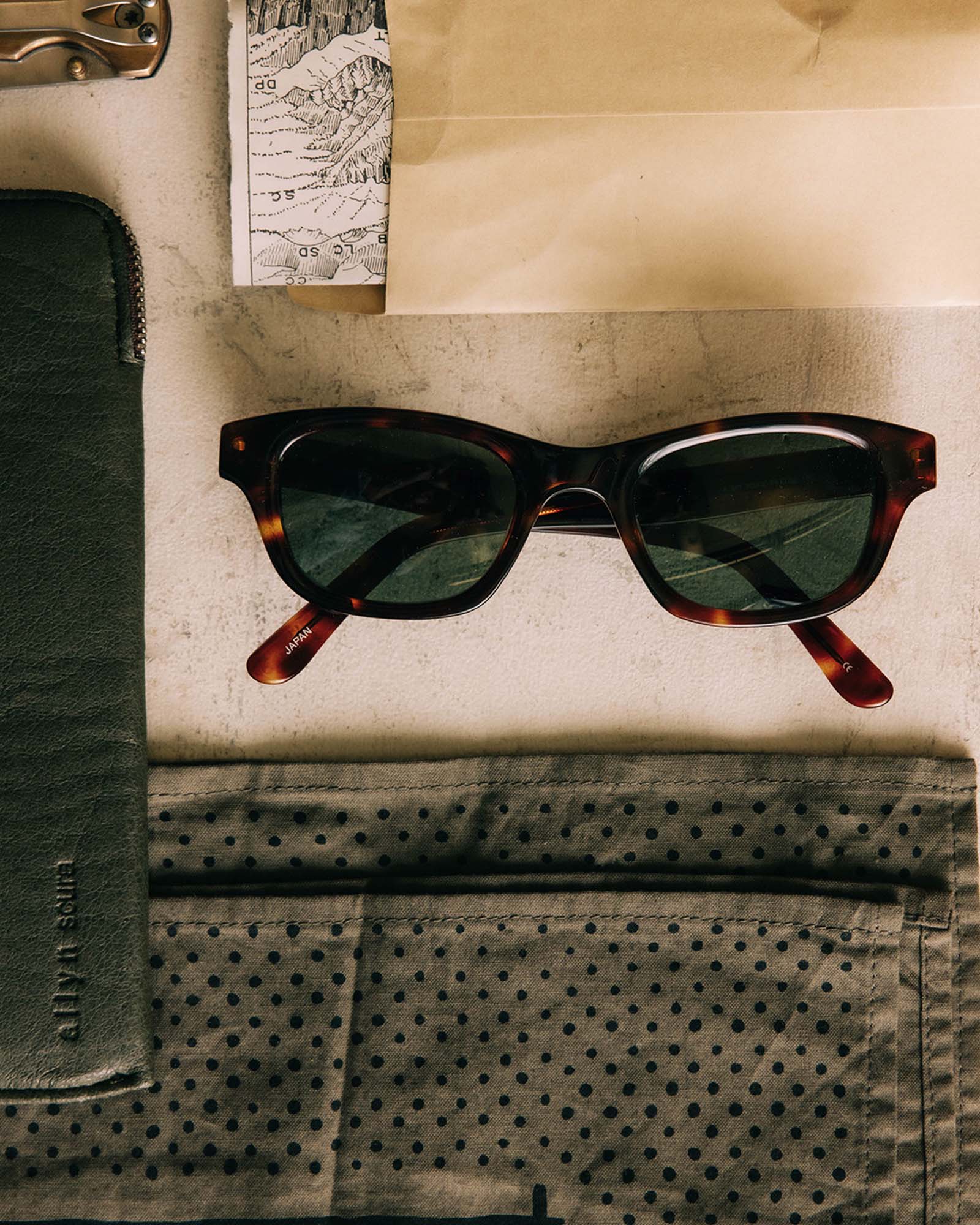 editorial flatlay of The Sergio in Demi Amber, Accessories by Taylor Stitch