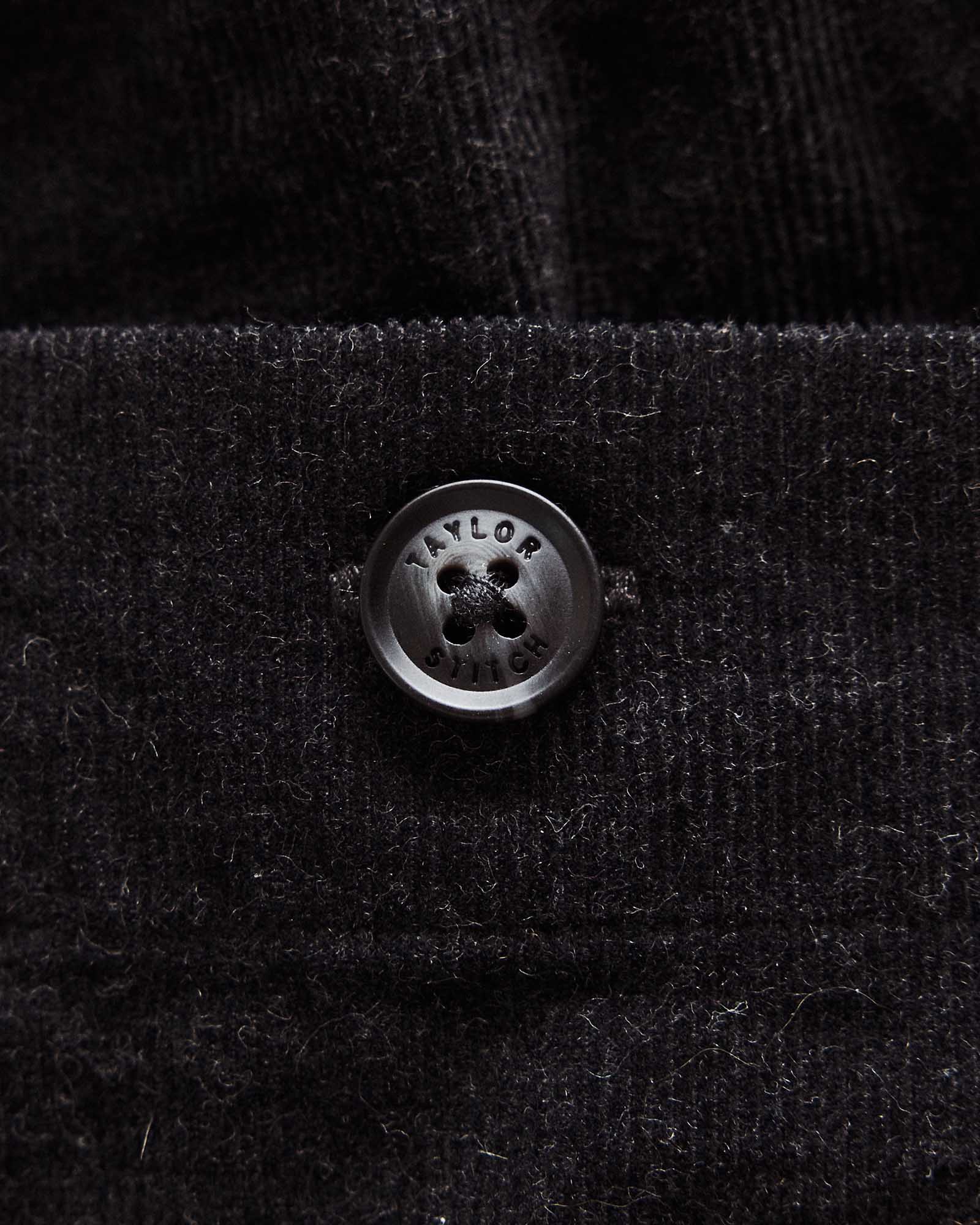 material shot of the button on The Apres Short in Heather Coal Pincord, Bottoms by Taylor Stitch