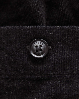 material shot of the button on The Apres Short in Heather Coal Pincord, Bottoms by Taylor Stitch