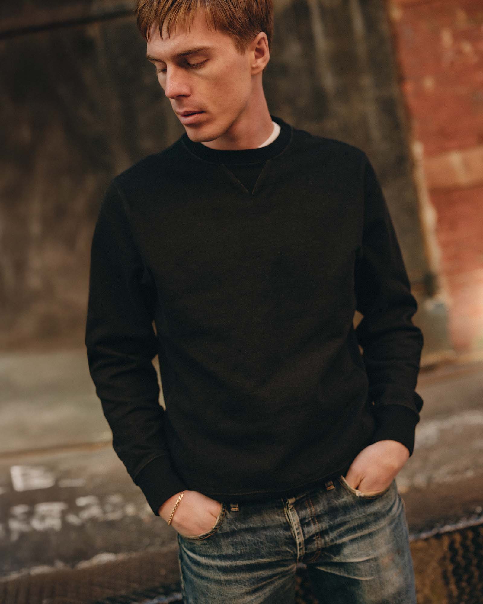 fit model posing in The Apres Crew in Black Indigo Terry, Knits by Taylor Stitch