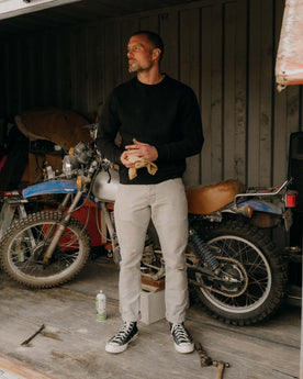 fit model posing in The Apres Crew in Black Indigo Terry, Knits by Taylor Stitch