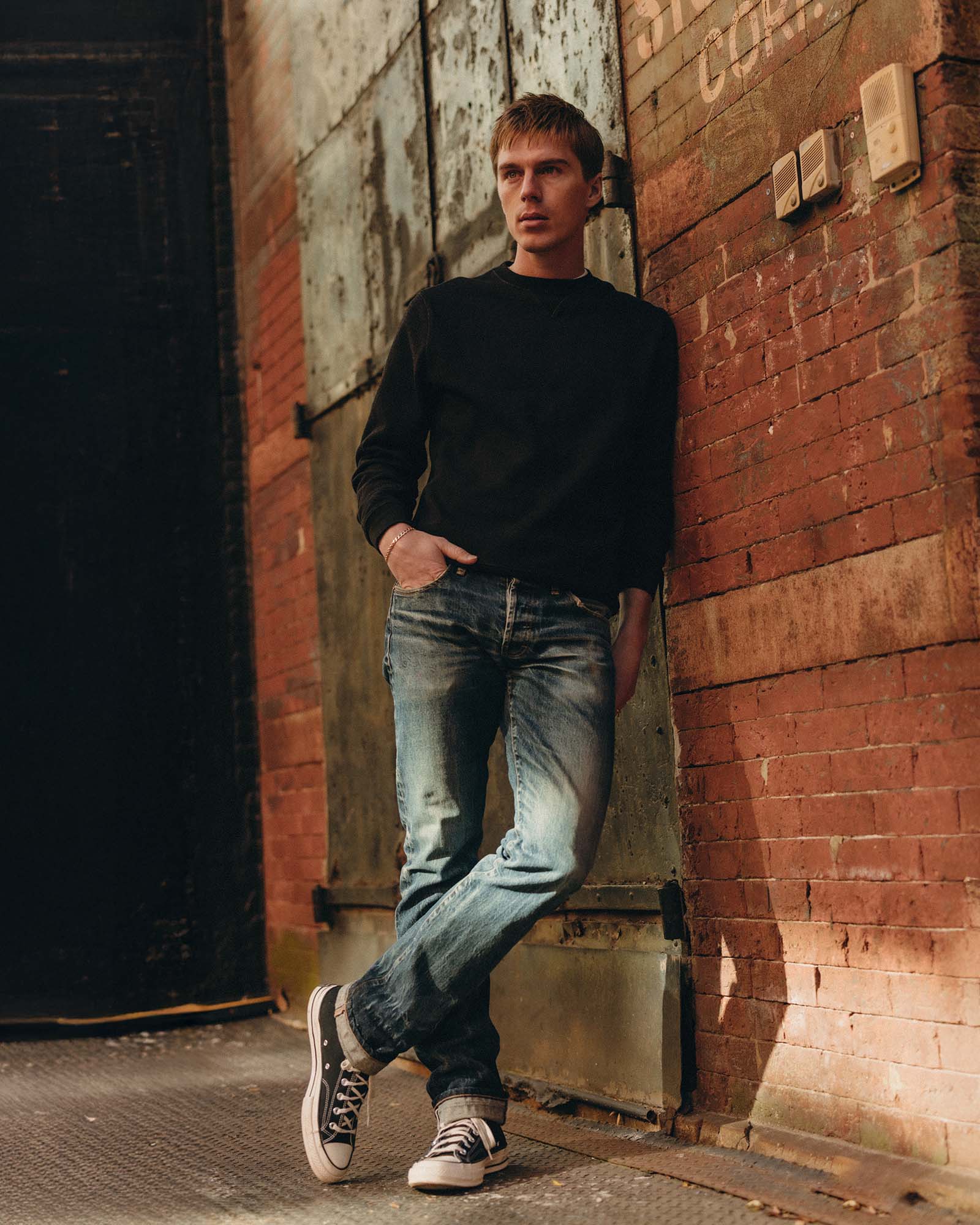 fit model showing off The Apres Crew in Black Indigo Terry, Knits by Taylor Stitch