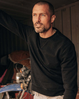 fit model showing off The Apres Crew in Black Indigo Terry, Knits by Taylor Stitch