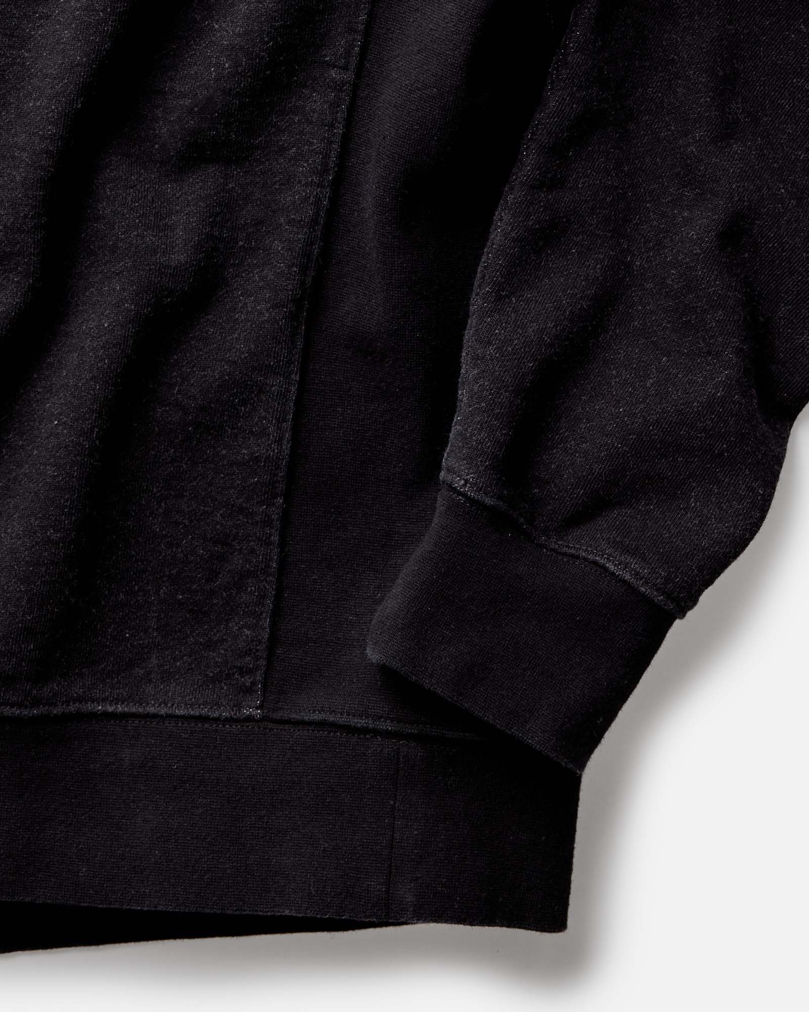 fit model on a motorcycle wearing The Apres Crew in Black Indigo Terry, Knits by Taylor Stitch