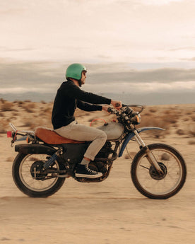 fit model on a motorcycle wearing The Apres Crew in Black Indigo Terry, Knits by Taylor Stitch