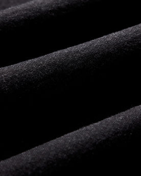 material shot of the hem on The Apres Crew in Black Indigo Terry, Knits by Taylor Stitch