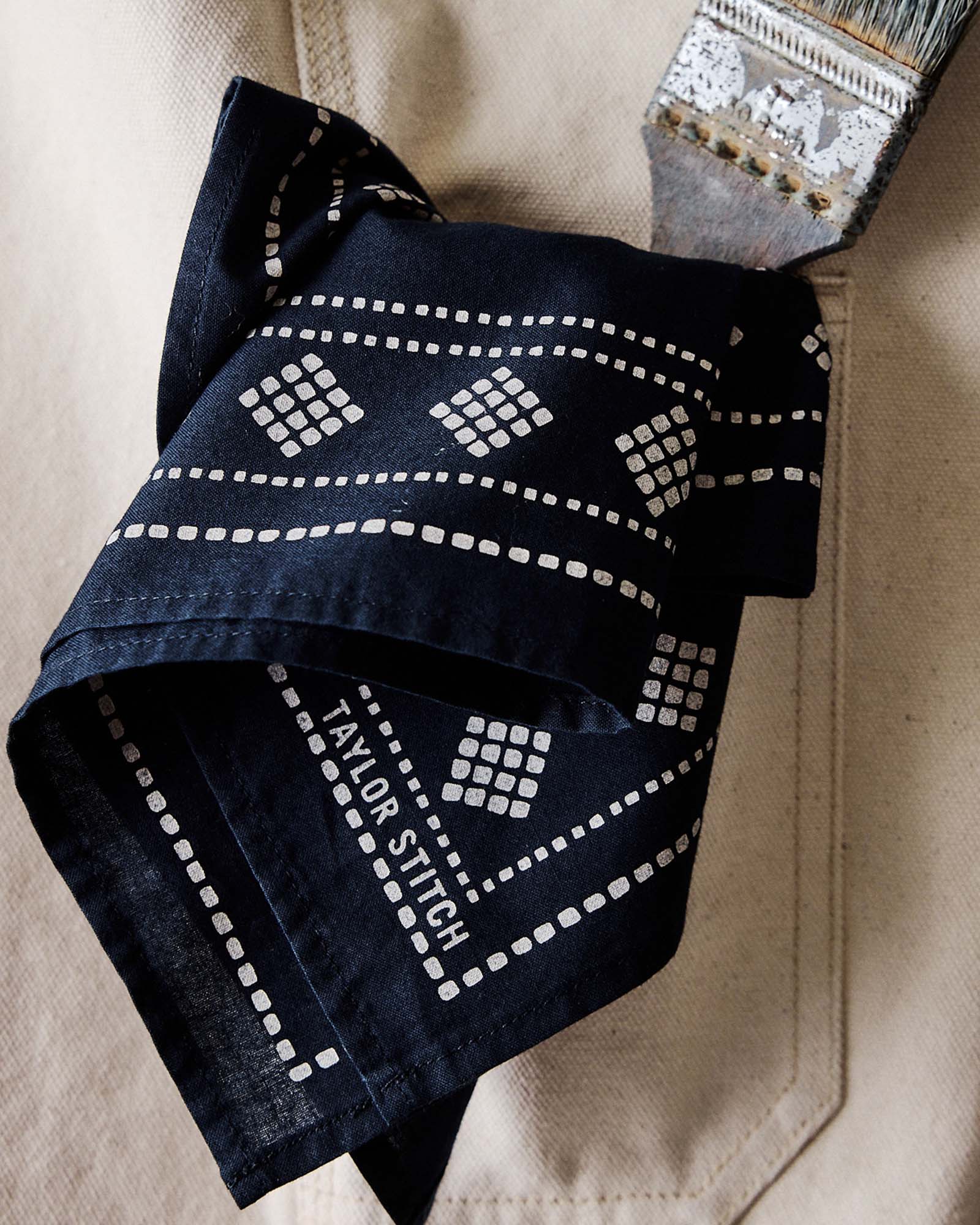 editorial image of The Bandana in Navy Diamond in a pants pocket, Accessories by Taylor Stitch