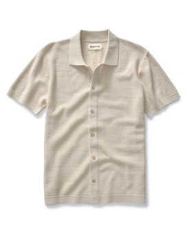 flatlay of The Button Down Polo in Heather Oat Herringbone, Knits by Taylor Stitch
