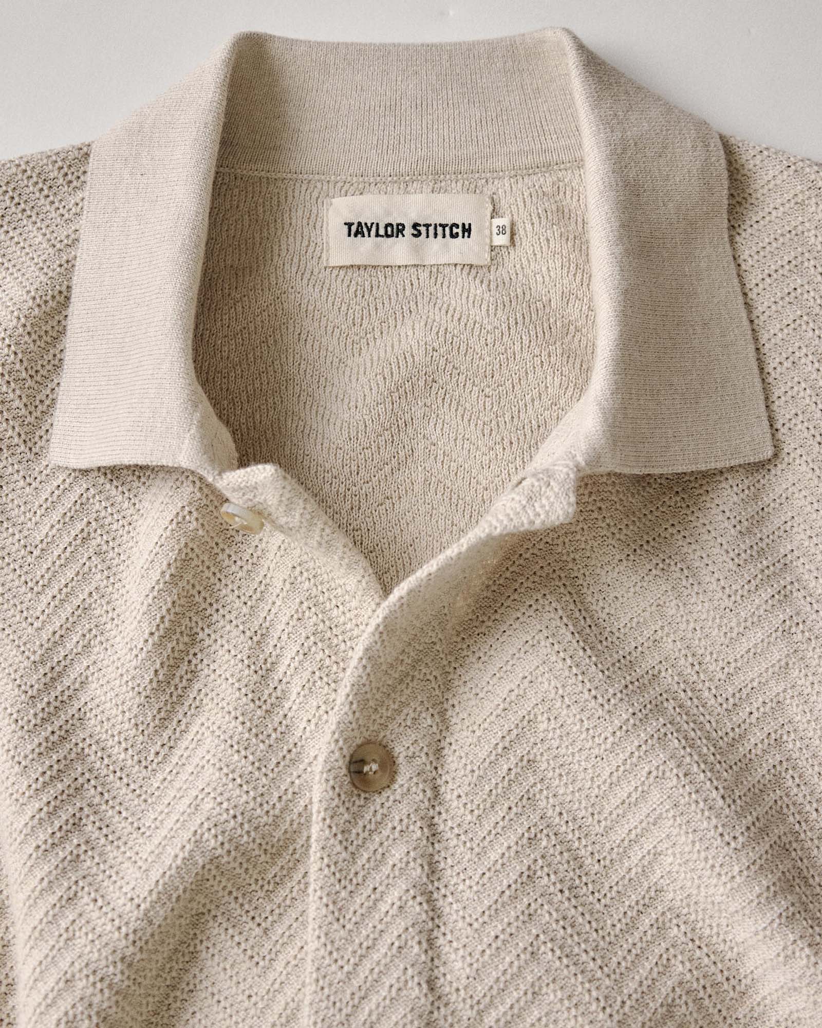 material shot of the collar on The Button Down Polo in Heather Oat Herringbone, Knits by Taylor Stitch