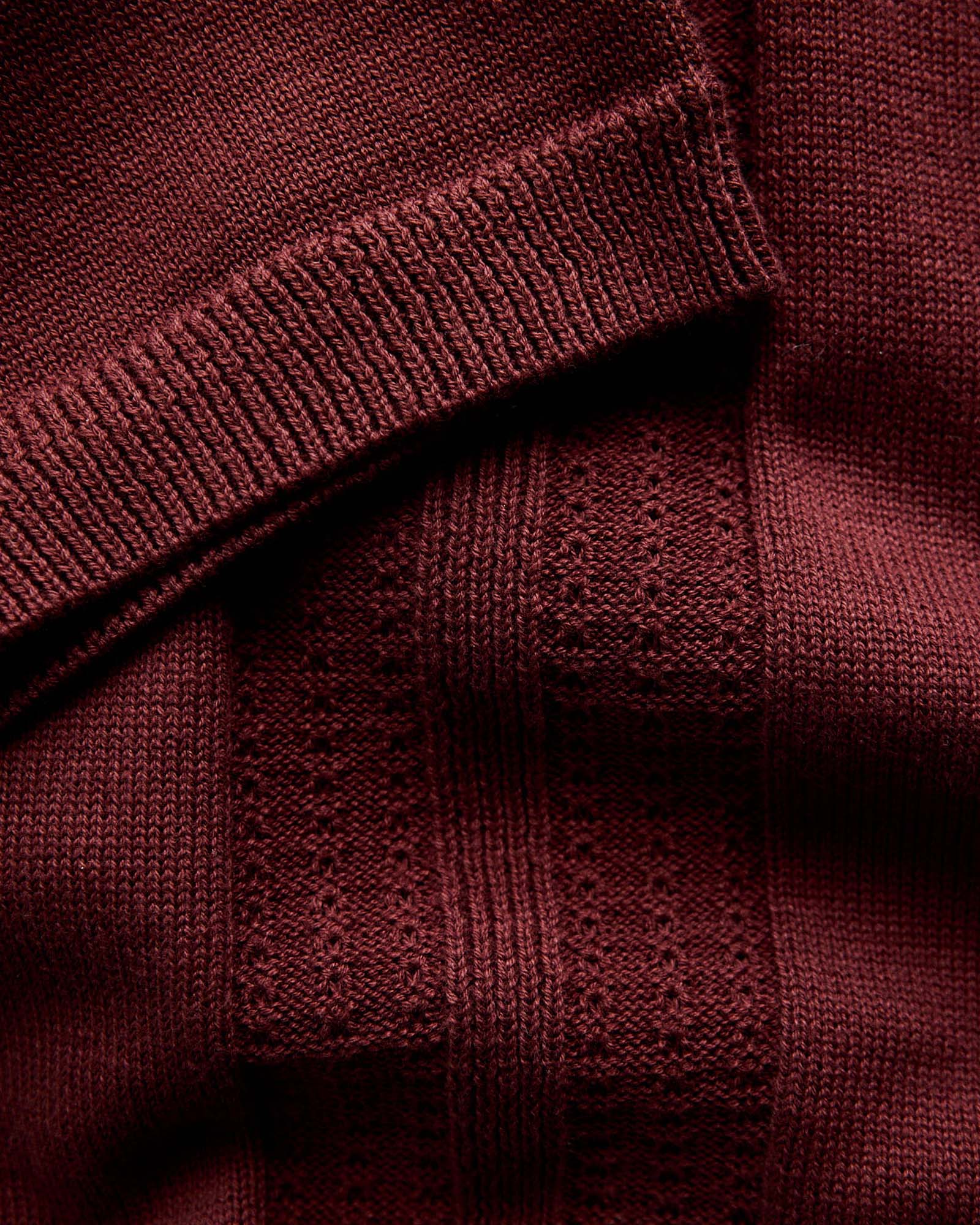 material shot of the sleeves on The Button Down Polo in Dried Cherry Stripe, Knits by Taylor Stitch
