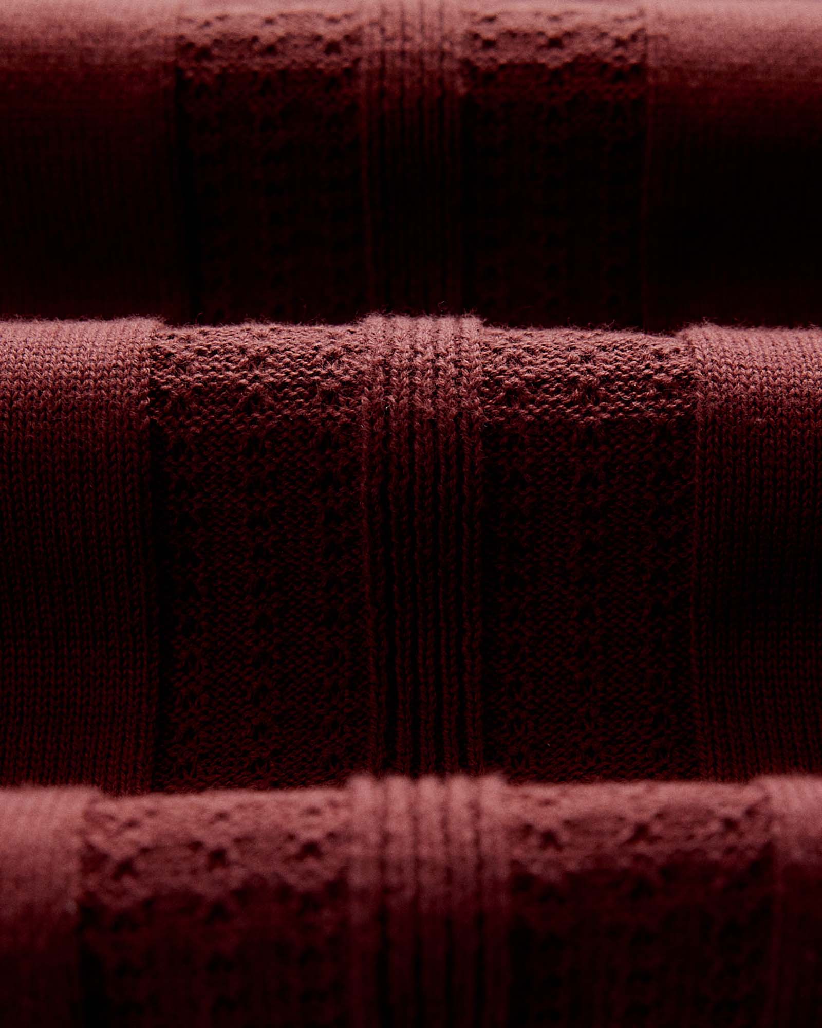 material shot of the fabric on The Button Down Polo in Dried Cherry Stripe, Knits by Taylor Stitch