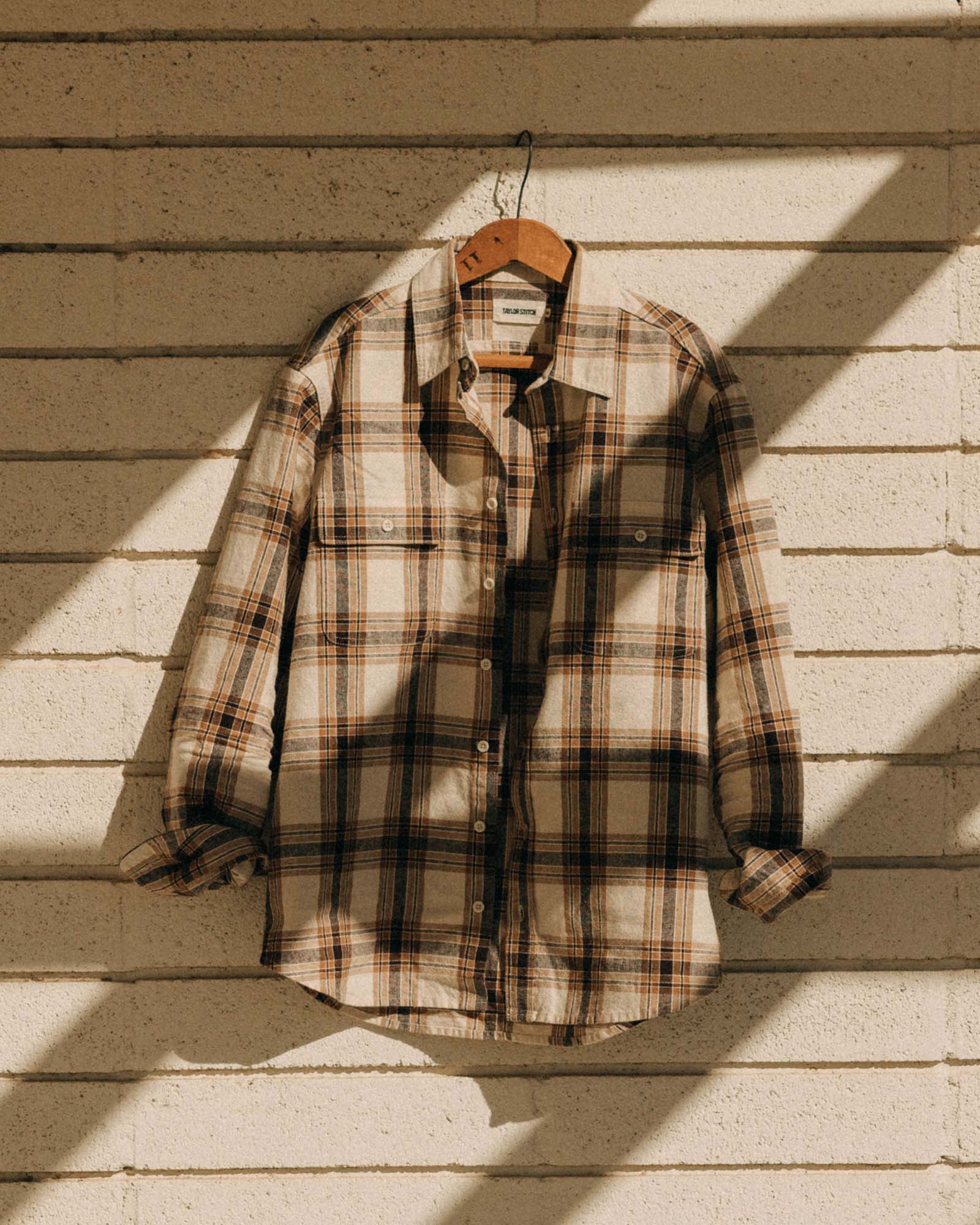 editorial image of The Craftsman Shirt in Bark Plaid Linen hanging, Wovens by Taylor Stitch