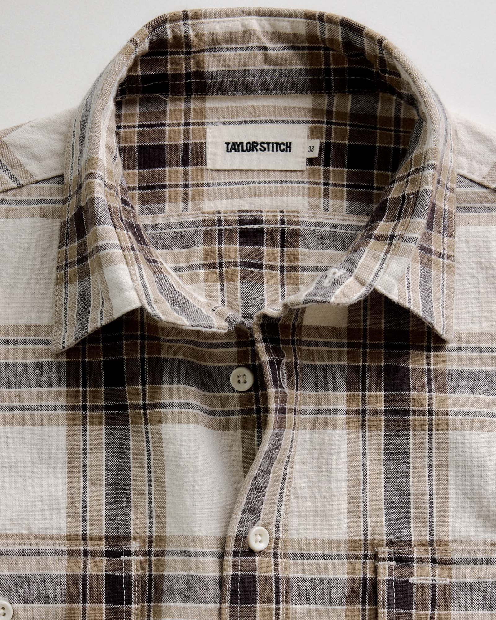 material shot of the collar on The Craftsman Shirt in Bark Plaid Linen, Wovens by Taylor Stitch