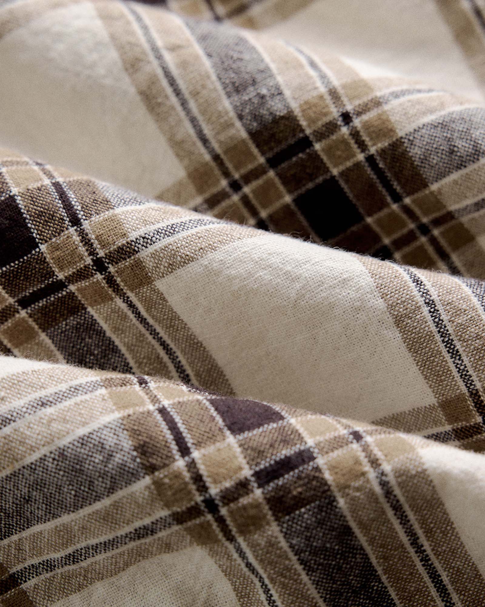 material shot of the fabric on The Craftsman Shirt in Bark Plaid Linen, Wovens by Taylor Stitch