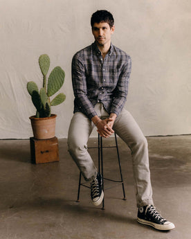 fit model sitting wearing The Jack in Navy Plaid Linen, Wovens by Taylor Stitch