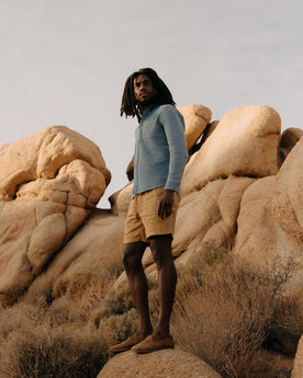 fit model standing on a rock wearing The Jack in Washed Indigo Waffle, Wovens by Taylor Stitch