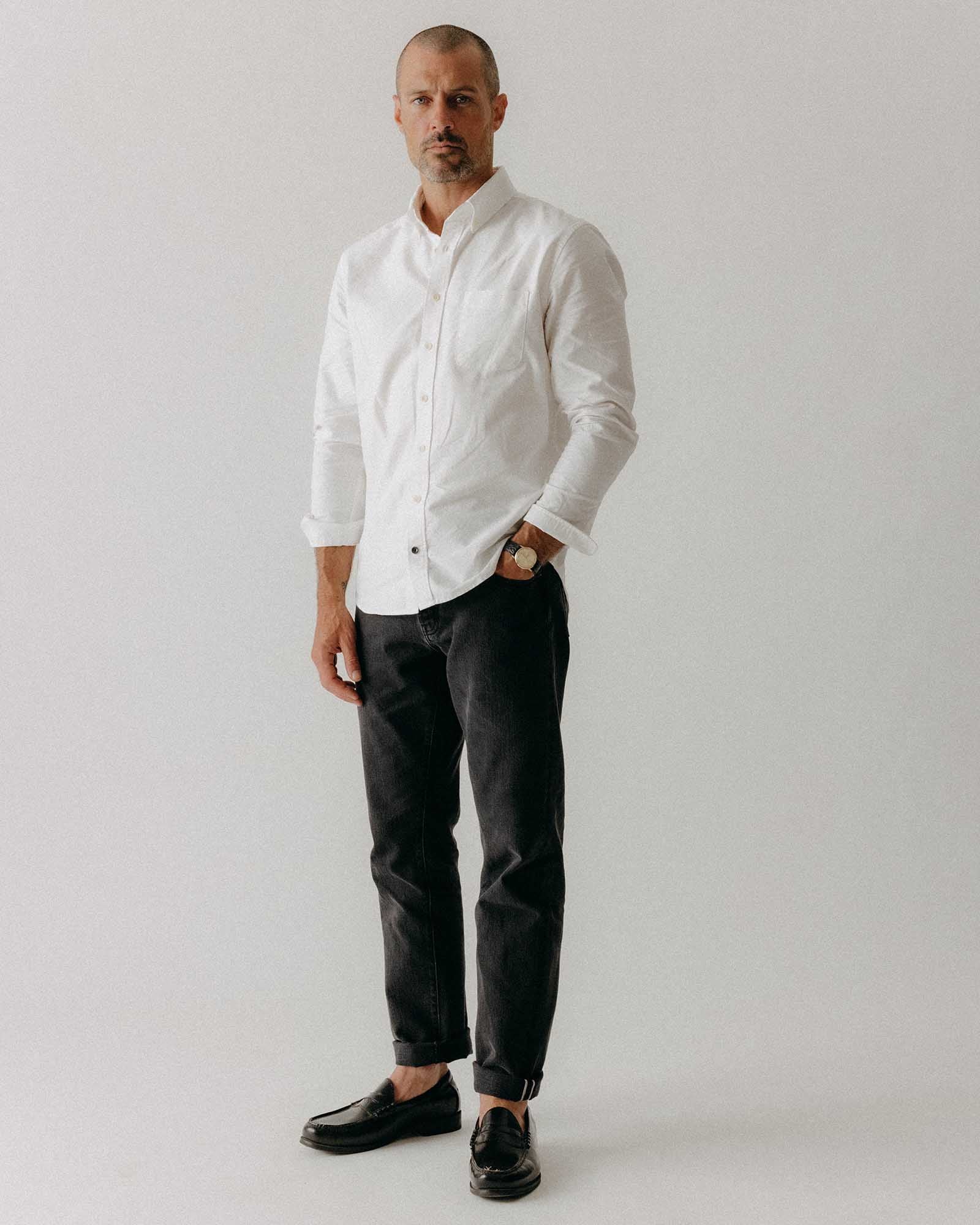 fit model standing wearing The Jack in White Everyday Oxford, Wovens by Taylor Stitch