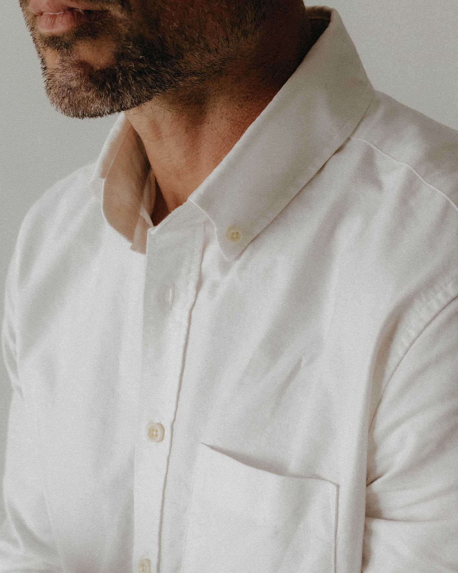 fit model showing off the collar on The Jack in White Everyday Oxford, Wovens by Taylor Stitch
