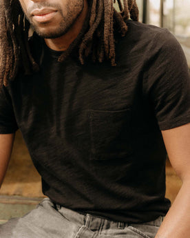 fit model posing in The Organic Cotton Tee in Black Indigo, Knits by Taylor Stitch