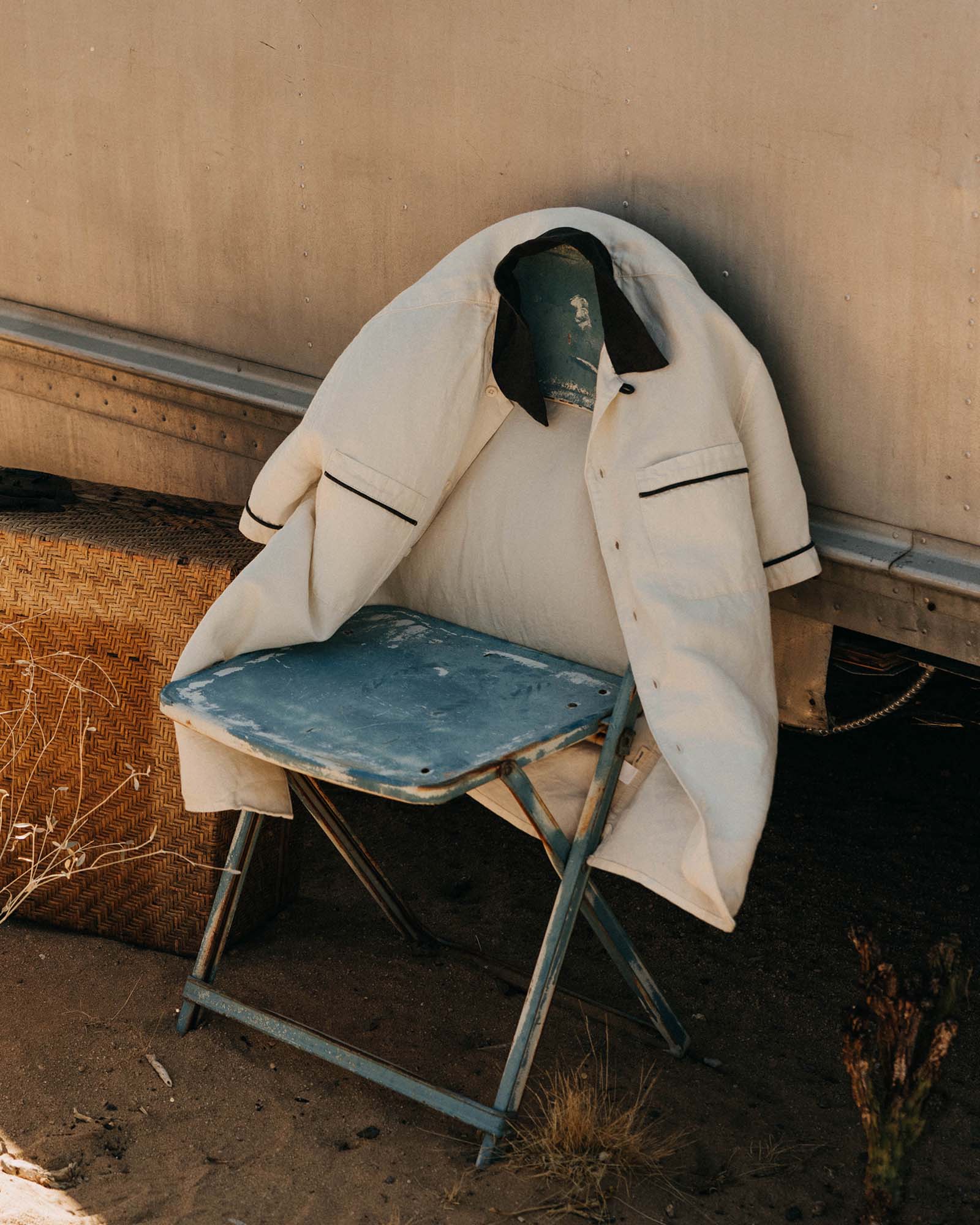 editorial image of The Weber Shirt in Vintage White on a chair, Wovens by Taylor Stitch