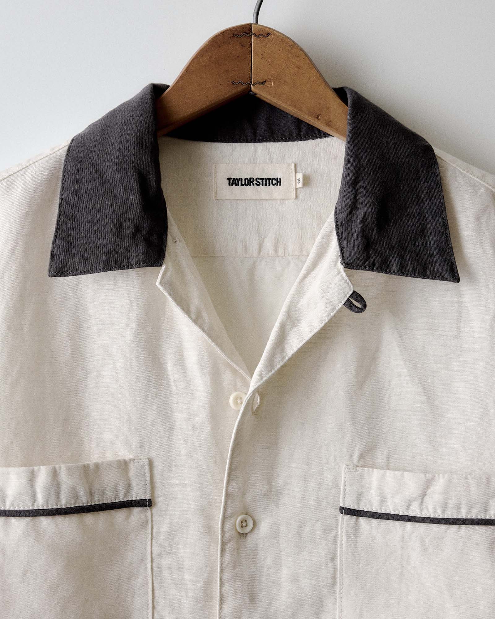 editorial image of The Weber Shirt in Vintage White hanging, Wovens by Taylor Stitch