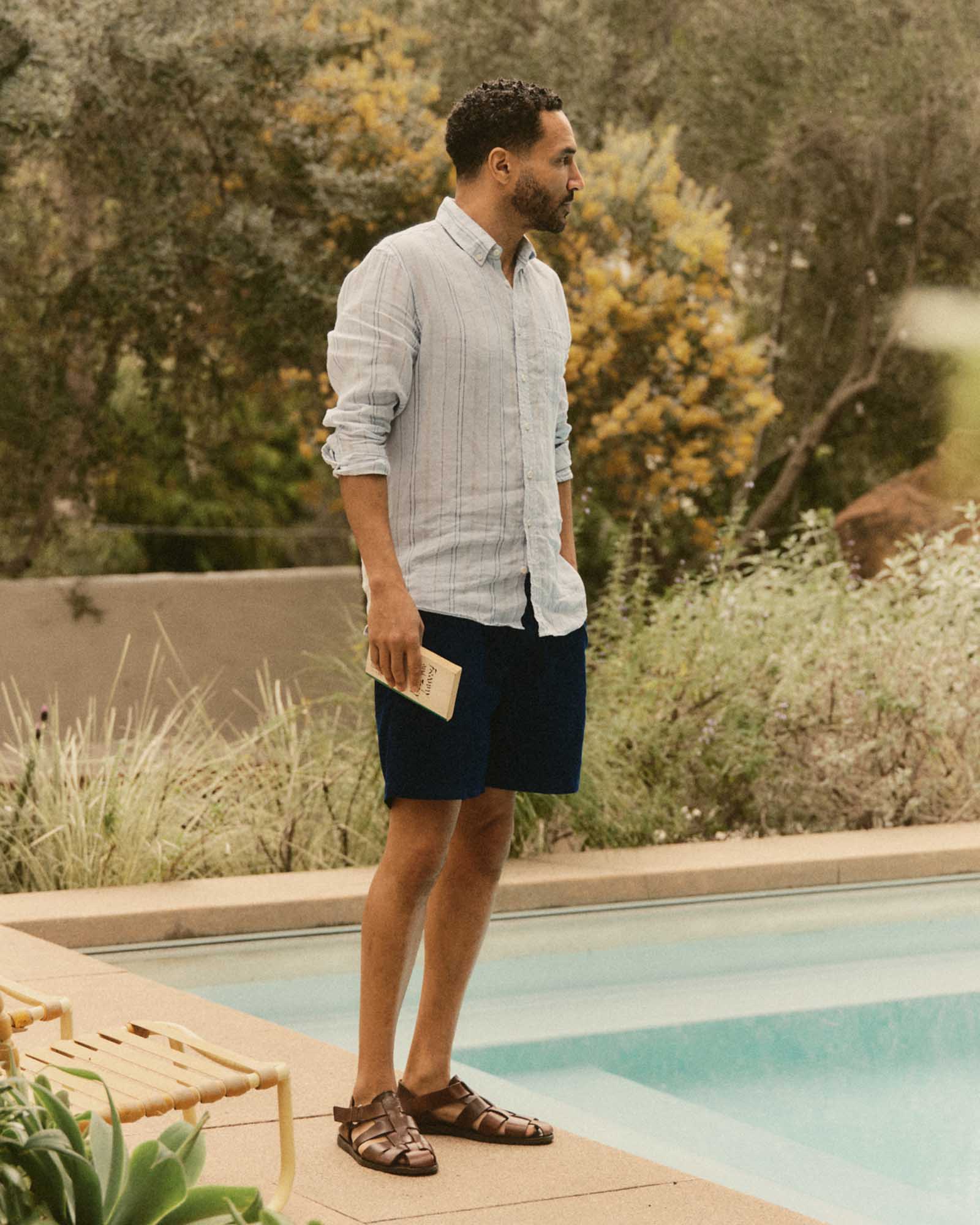 fit model posing in The Apres Short in Rinsed Indigo Pincord, Bottoms by Taylor Stitch