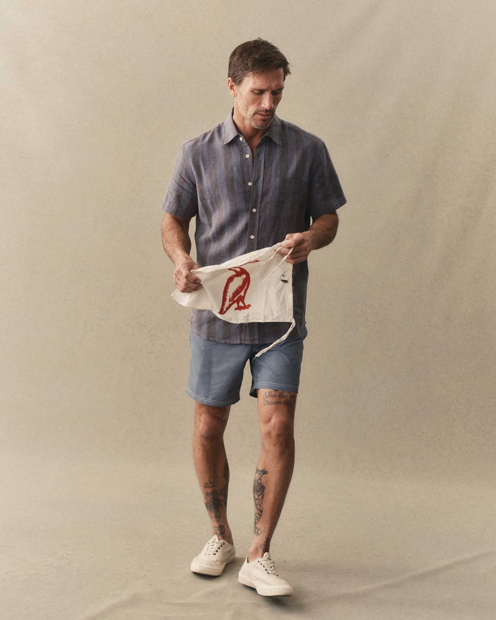 fit model walking wearing The Drift Boardshort in Bluefin, Bottoms by Taylor Stitch