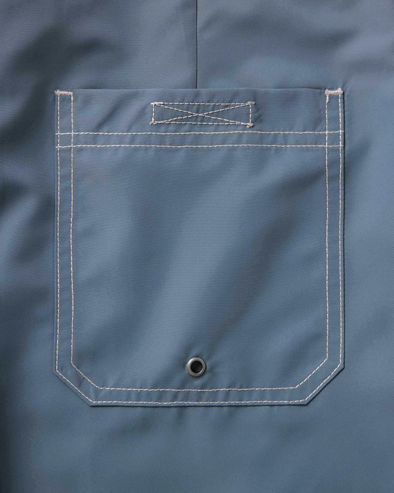 material shot of the back pocket on The Drift Boardshort in Bluefin, Bottoms by Taylor Stitch