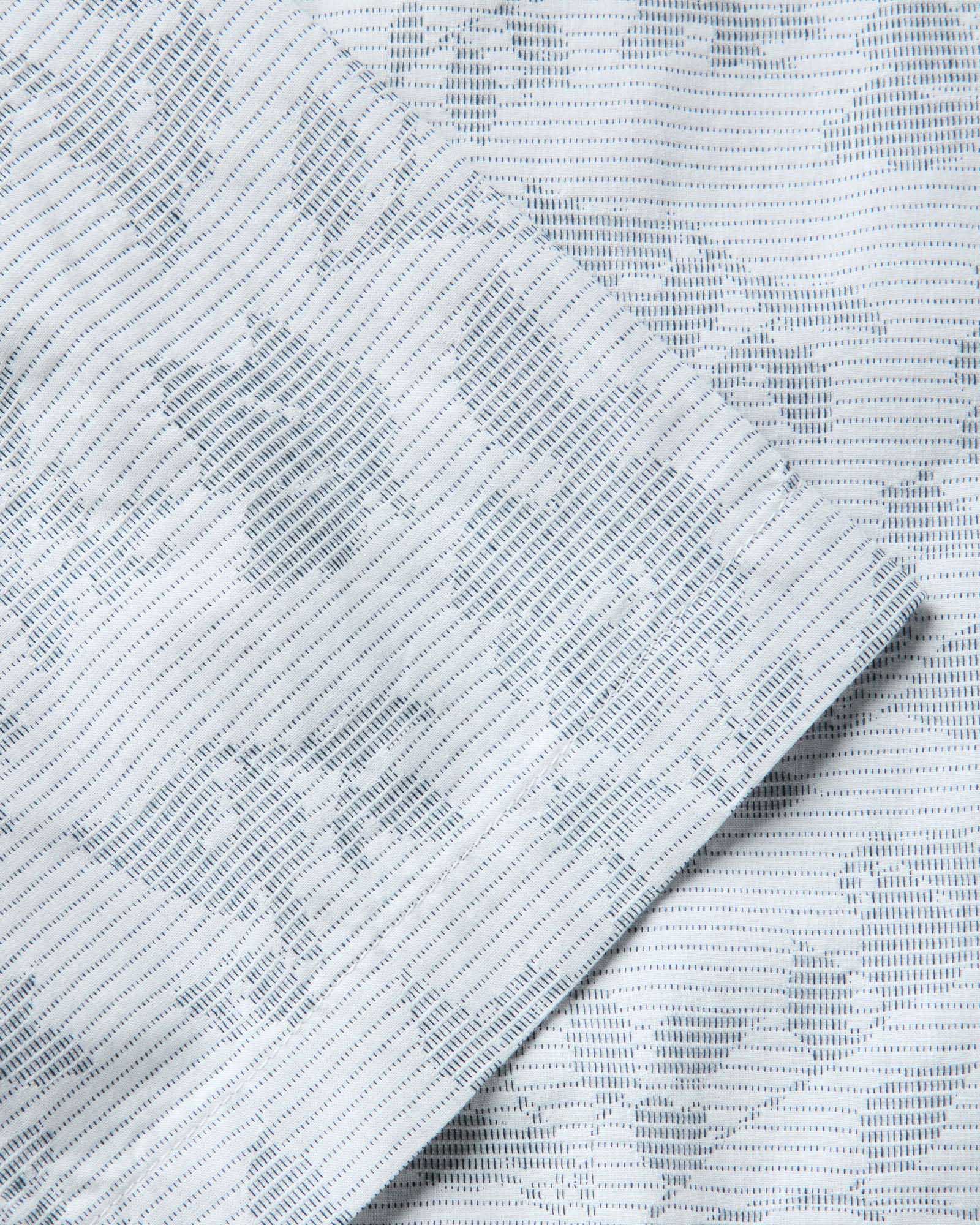 material shot of the sleeve on The Hawthorne Shirt in Sky Blue Floral Jacquard, Wovens by Taylor Stitch