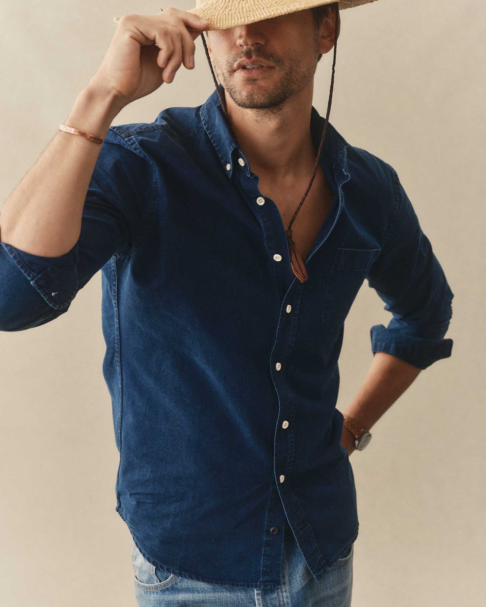 fit model posing in The Jack in Rinsed Indigo Oxford, Wovens by Taylor Stitch