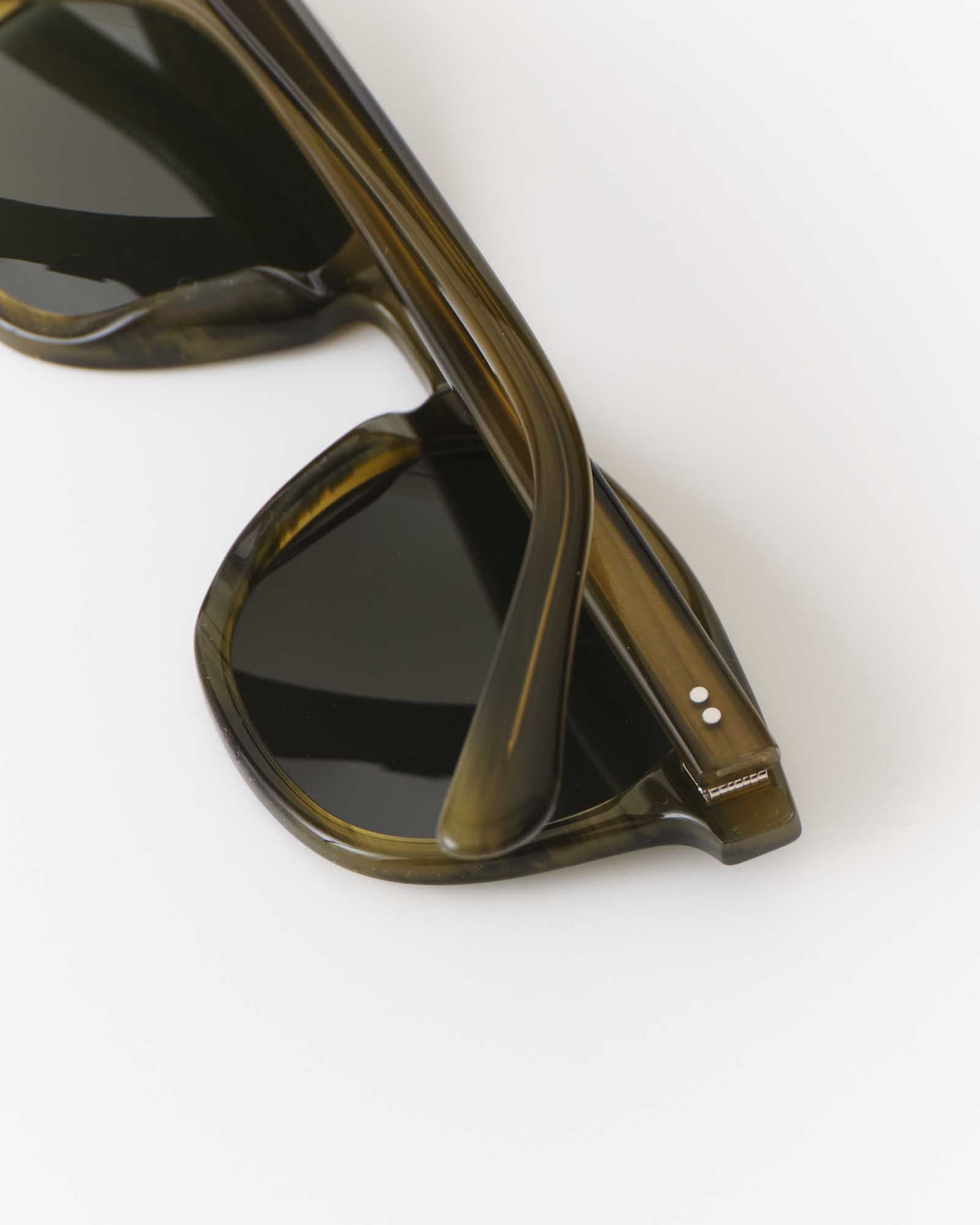 editorial image of the side of The Legend in Green Tortoise, Accessories by Taylor Stitch