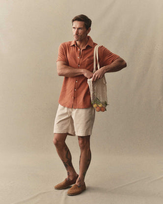 fit model posing in The Short Sleeve California in Heather Driftwood Double Knit