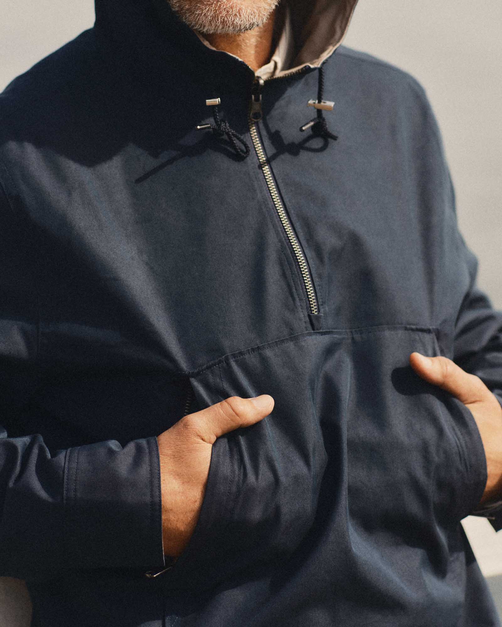 fit model showing off the pocket on The Squall Anorak in Navy Twill, Outerwear by Taylor Stitch