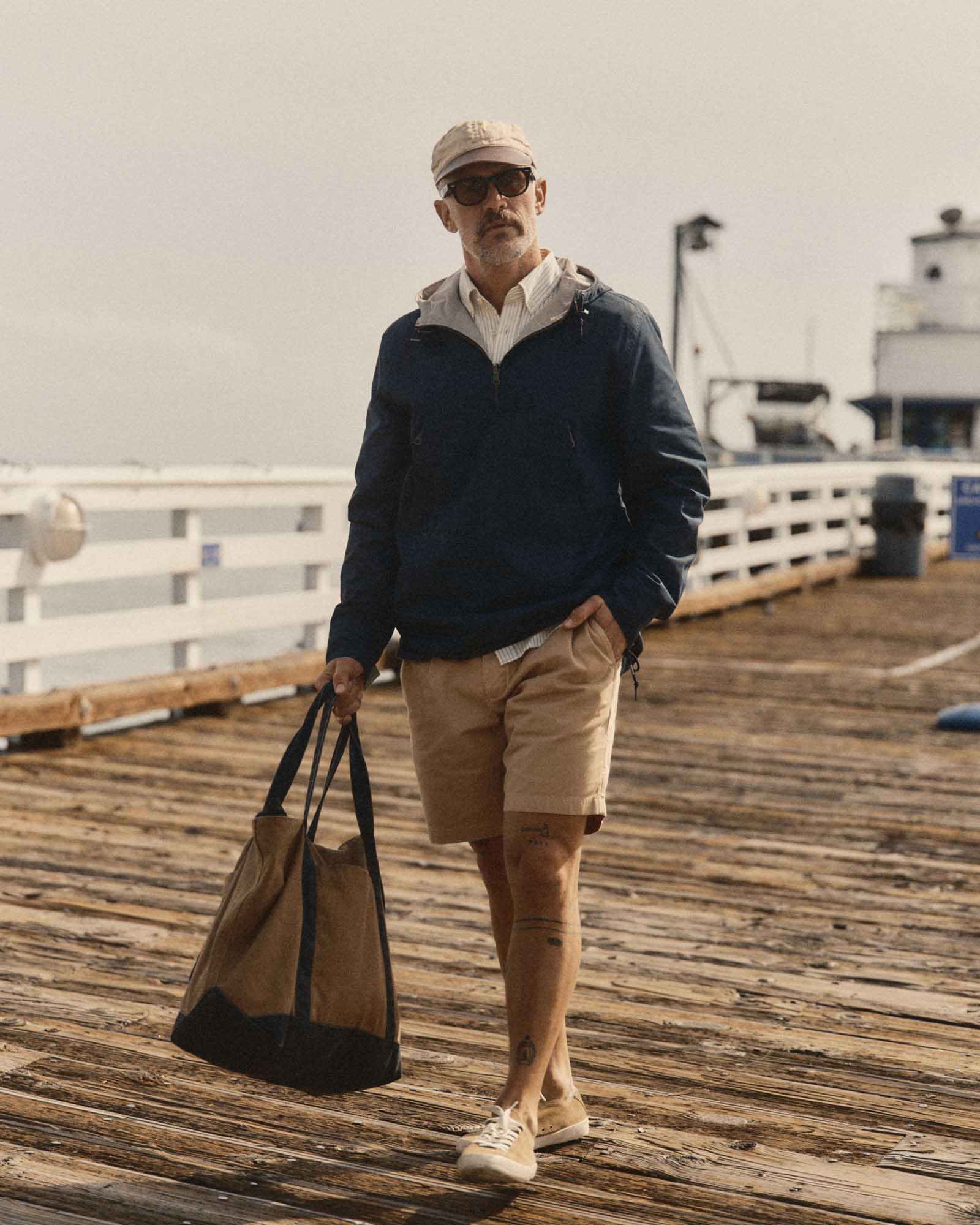 fit model walking in The Squall Anorak in Navy Twill, Outerwear by Taylor Stitch