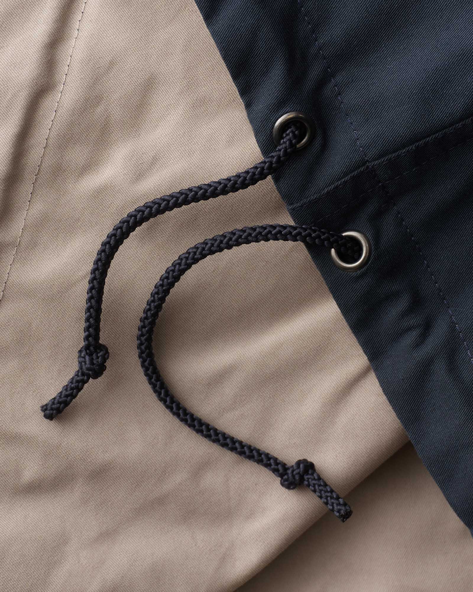 material shot of the laces on The Squall Anorak in Navy Twill, Outerwear by Taylor Stitch