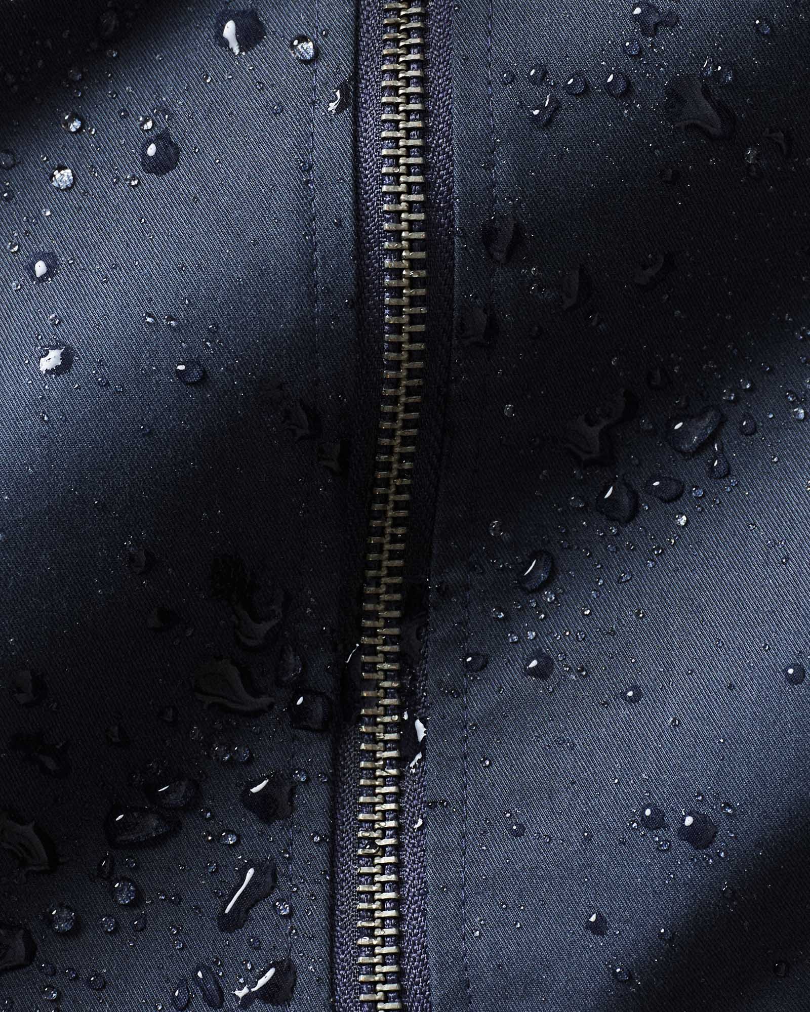 material shot of the zipper on The Squall Anorak in Navy Twill, Outerwear by Taylor Stitch