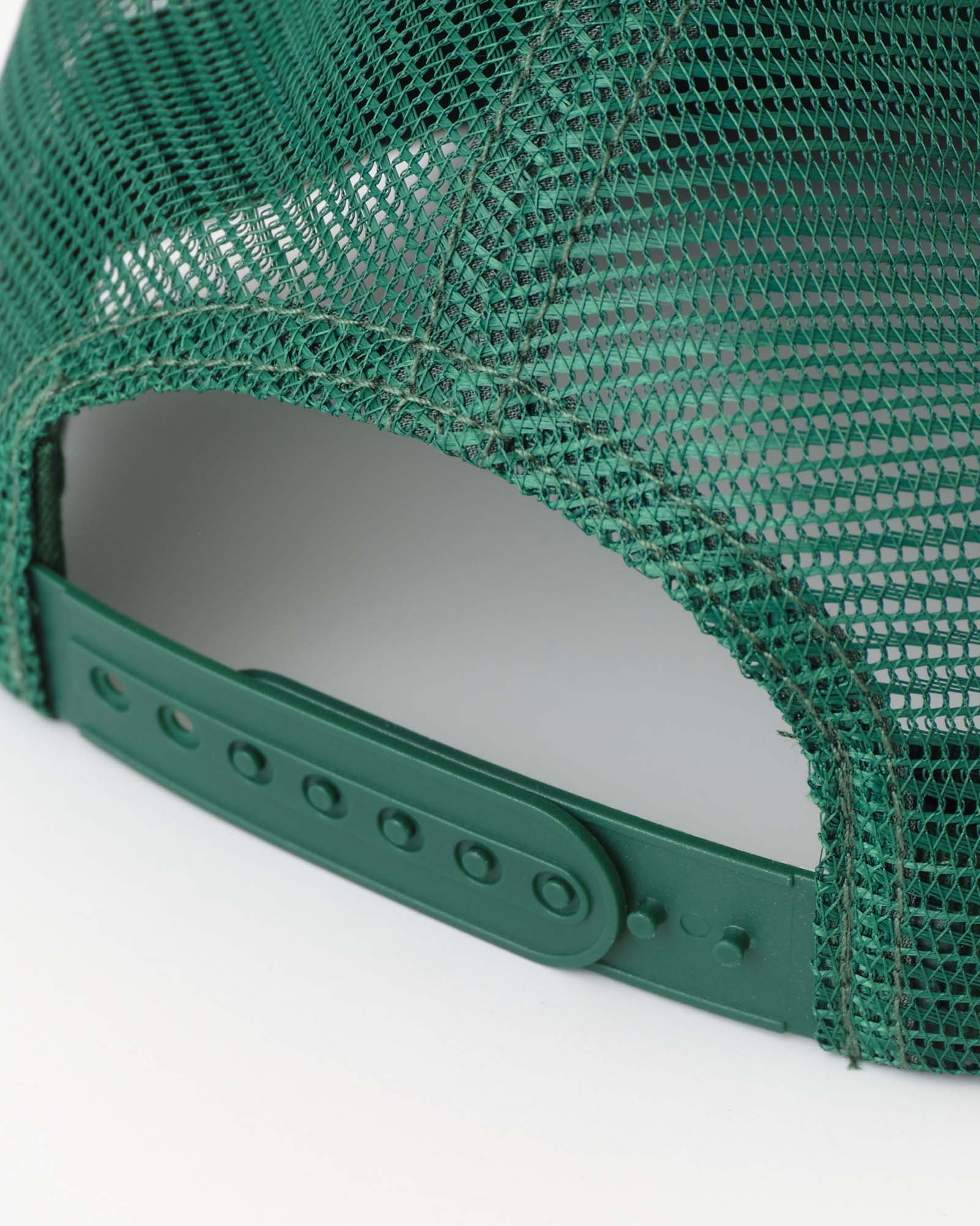 material shot of the back strap on The 6-Panel Trucker Cap in Emerald Mesh, Accessories by Taylor Stitch