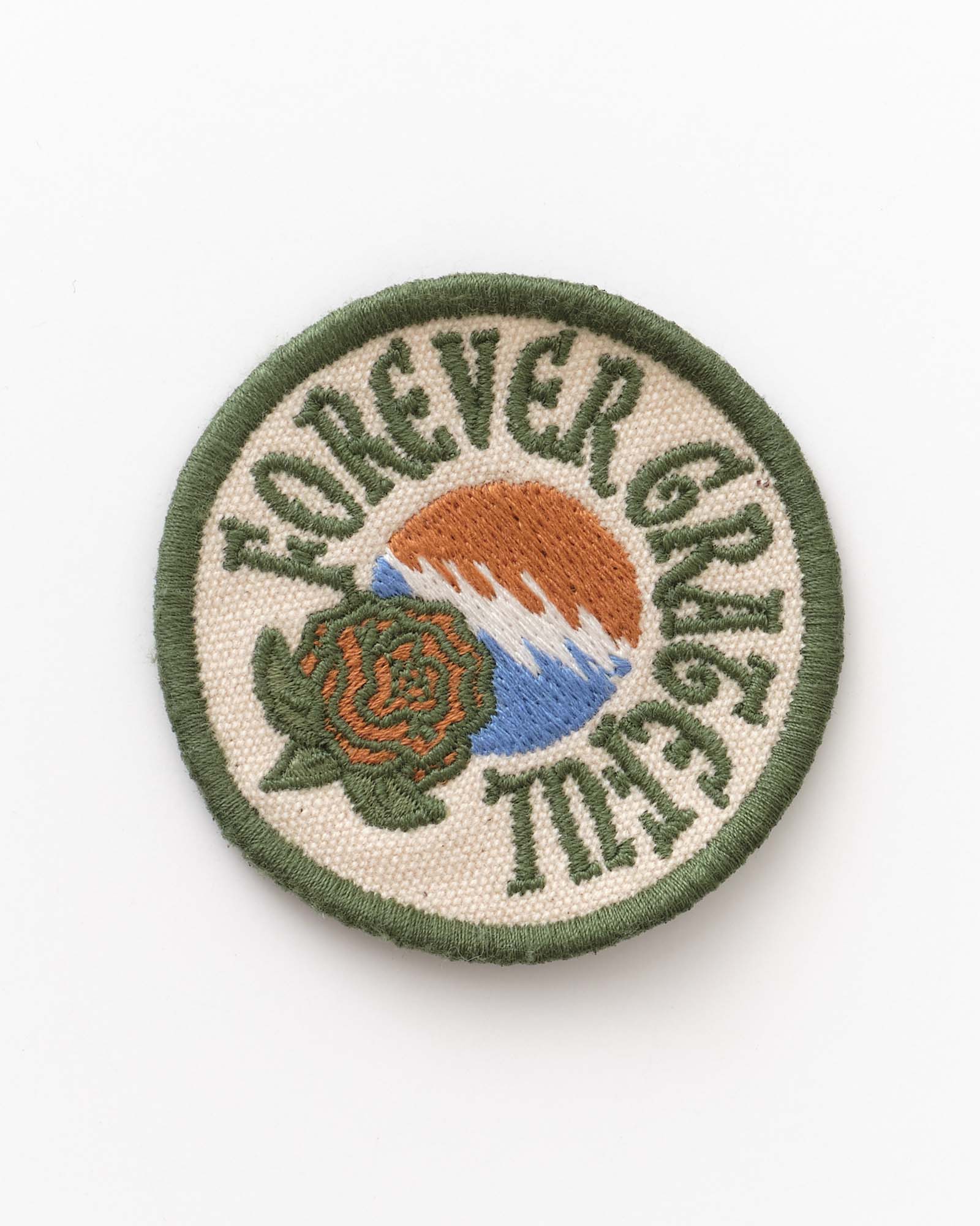 Circular patch with 'Forever Grateful' text and nature-themed design on a white background, Accessories by Taylor Stitch