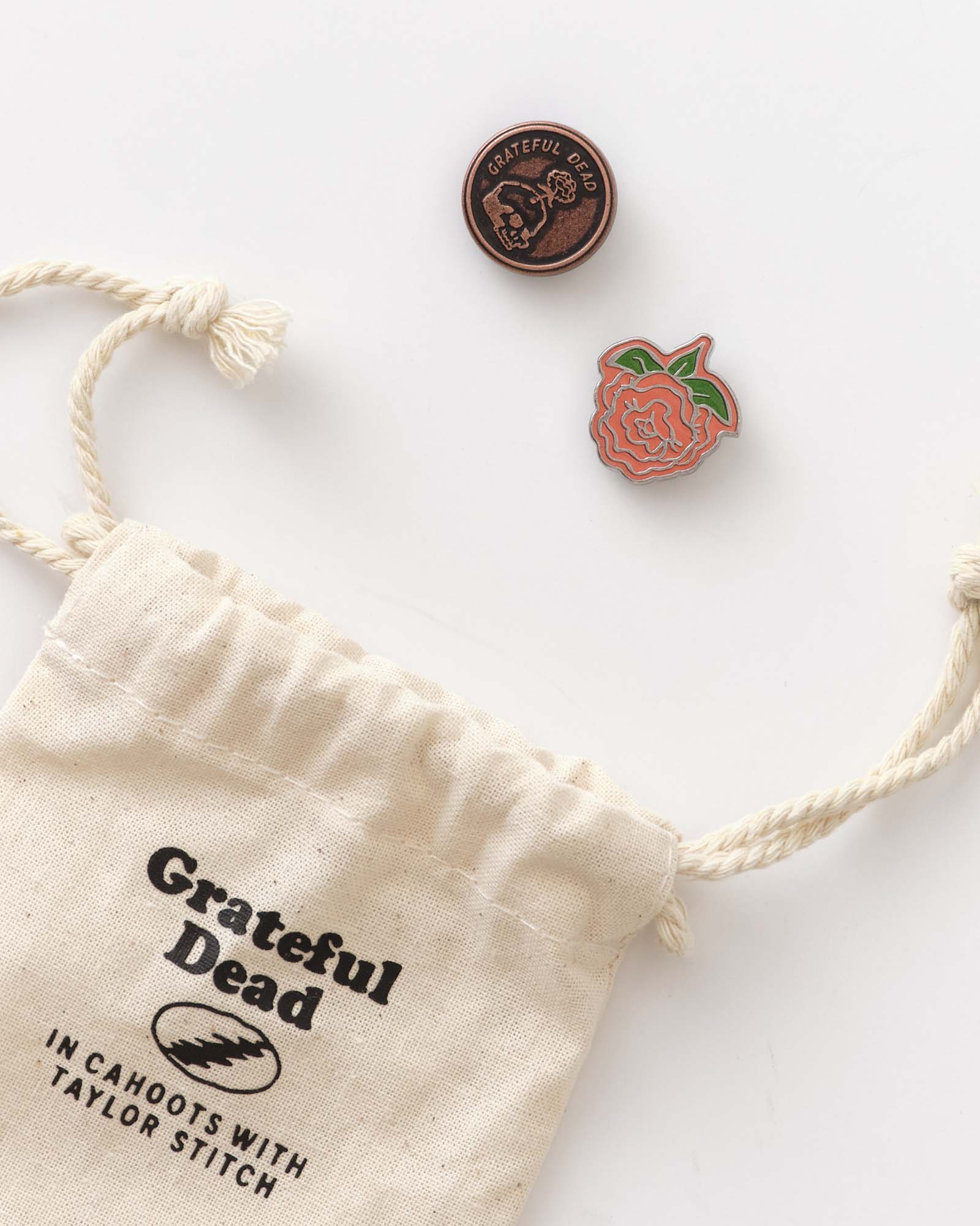 editorial image of The Magoo’s Pin Set next to bag, Accessories by Taylor Stitch