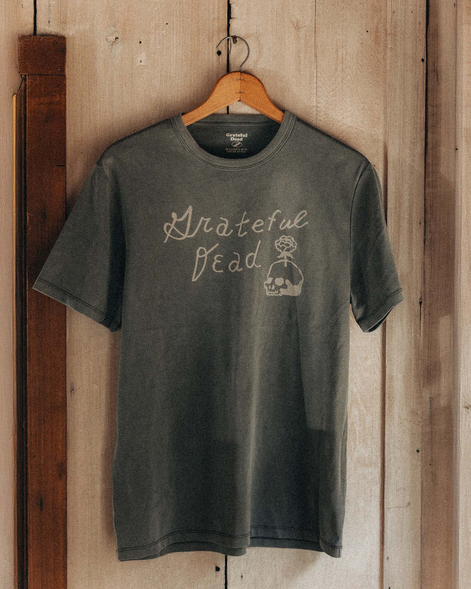 editorial image of The Organic Cotton Tee in Dead Script hanging, Knits by Taylor Stitch